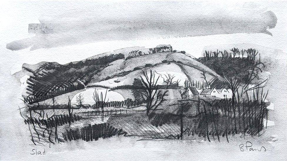 A black and white hilly landscape with a couple of buildings in the background