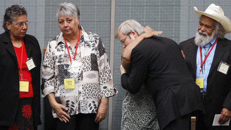 Kevin Rudd hugs members of the Stolen Generations after his apology speech in 2008