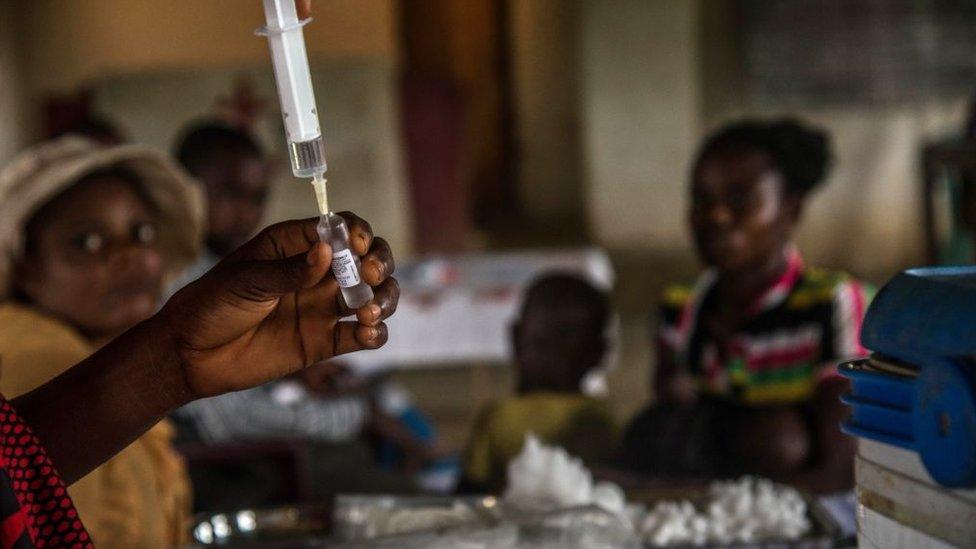 Children wait to be registered before a measles vaccination at a centre in Mbata-Siala, near Seke Banza, western DR Congo on March 3, 2020.