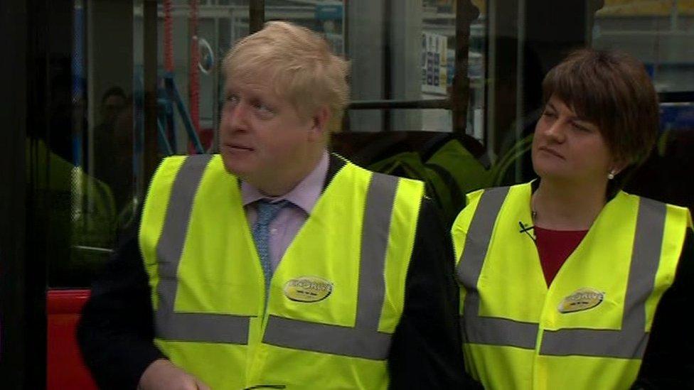 Boris Johnson and Arlene Foster survey operations at the County Antrim factory