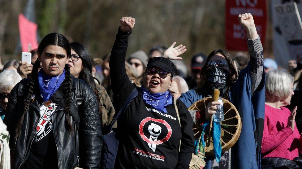 A group demonstrates against the expansion of the Trans Mountain pipeline project in Burnaby, British Columbia