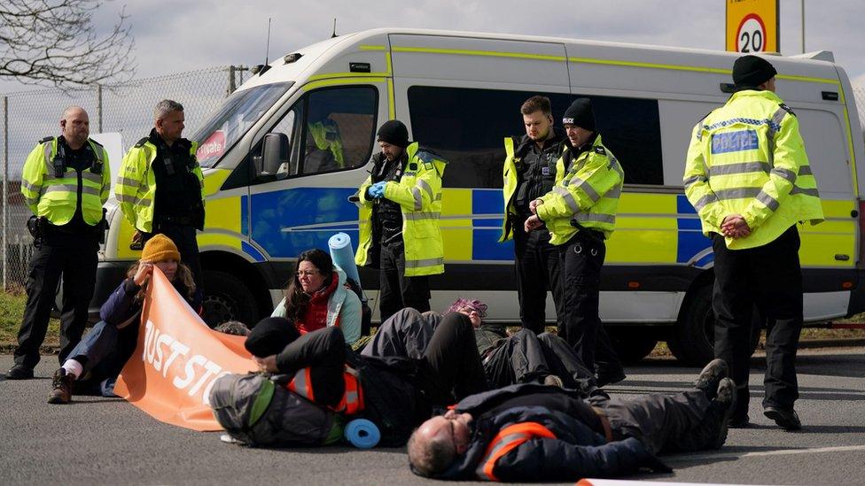 Police and protesters at Kingsbury oil terminal