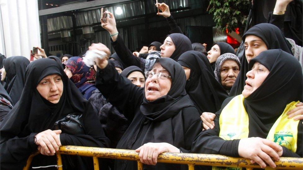 Lebanese women, supporting Lebanon"s Shiite militant group Hezbollah, mourn during the funeral of Mustafa Badreddine