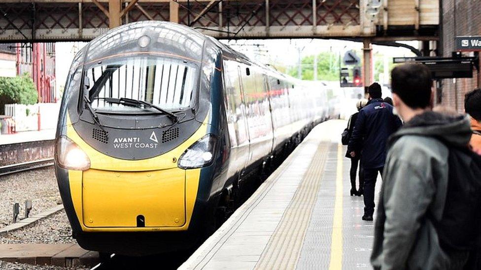 People wait to get on the Avanti West Coast train at Stoke-on-Trent