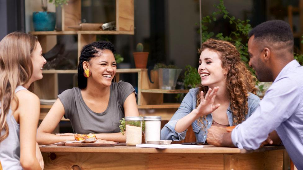 Young people chatting in a cafe