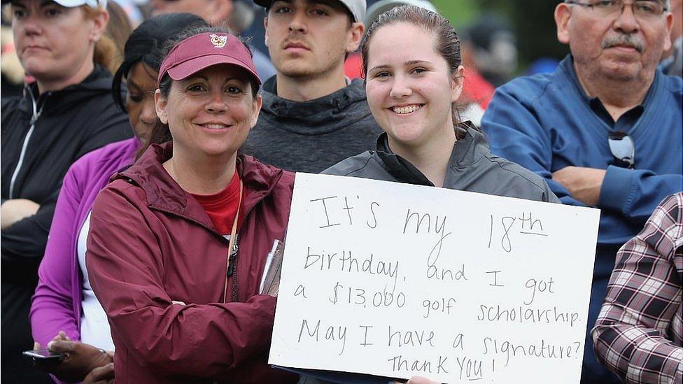 A young female golfer waiting in the autograph zone with a special message for players after they had finished their rounds during the third round of the 2019 Players Championship held on the Stadium Course at TPC Sawgrass on March 16, 2019 in Ponte Vedra Beach, Florida.