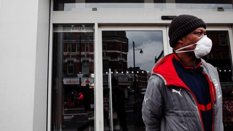 Photo of man outside shop