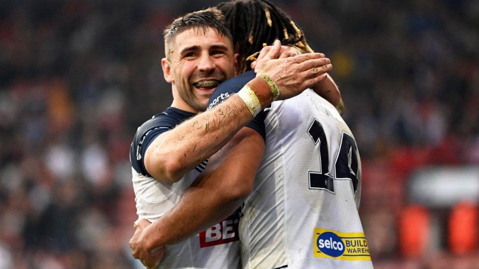 Dominic Young of England celebrating with his team mate Tommy Makinson