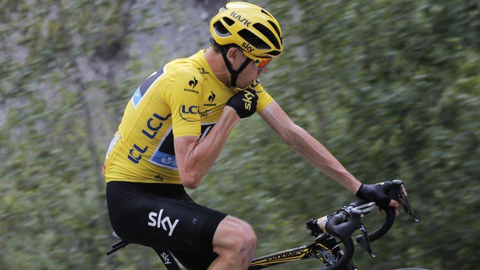 Britain"s Chris Froome talks to his race director