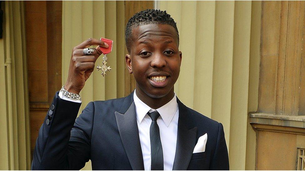 Jamal Edwards holding his MBE