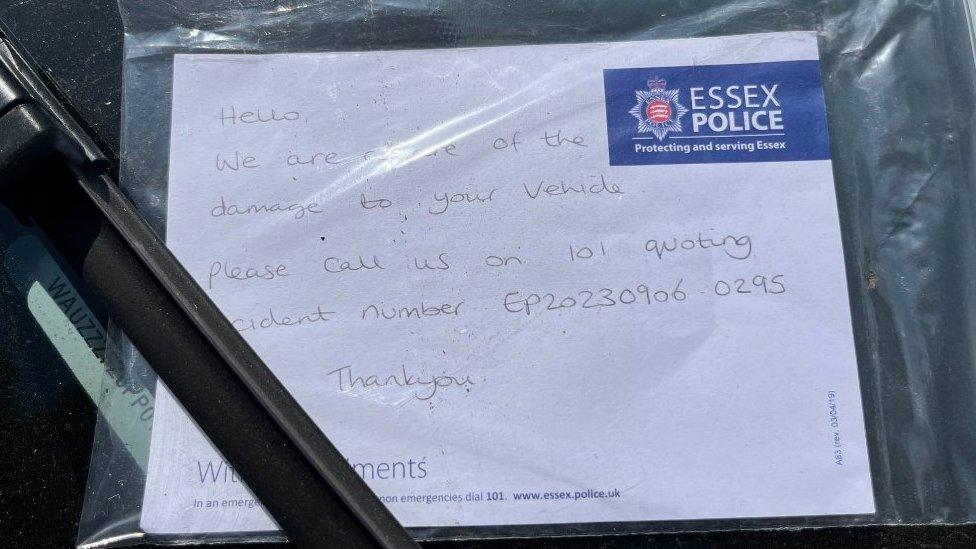 Note from police left on a damaged car