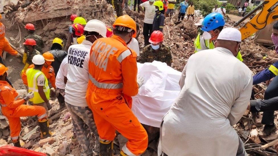 Members of the NDRF during a rescue operation at the site of a building collapse in Raigad, Maharashtra