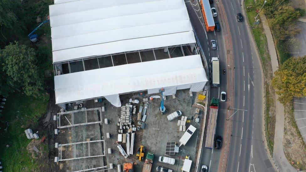 Aerial view of the tents being erected at Trinity Street burial ground