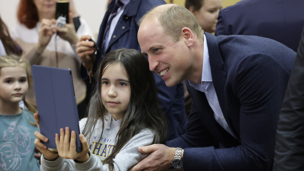 Prince William takes a selfie with a girl