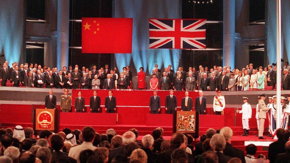 The handover ceremony showing the Chinese flag flying after the Union flag was lowered in Hong Kong in 1997