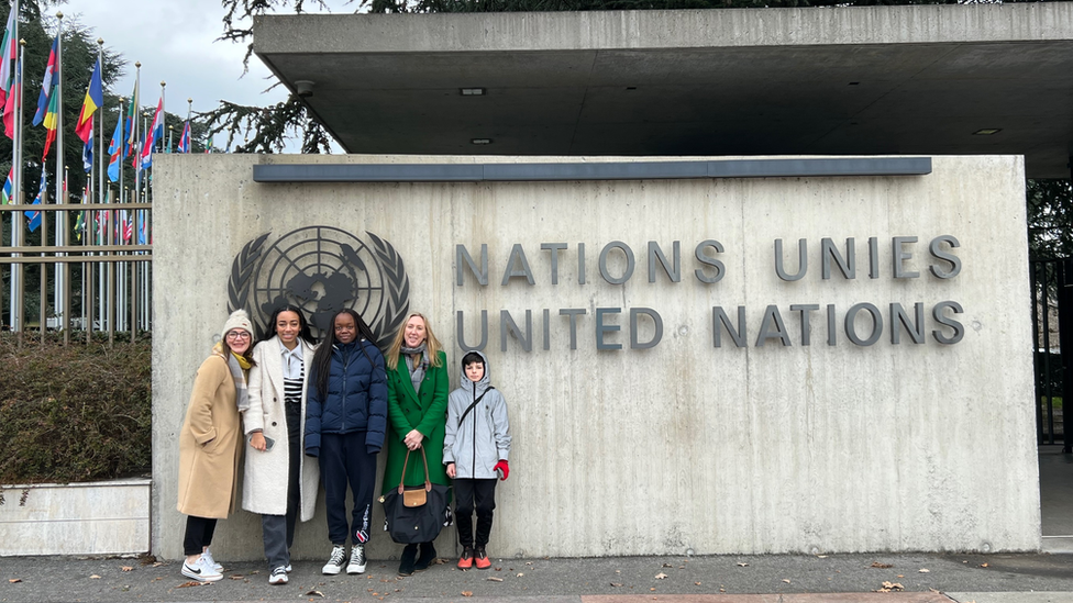 People outside UN sign in Geneva