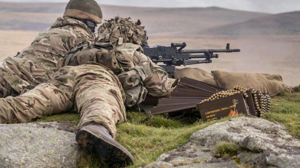 Soldiers fire a General Purpose Machine Gun at Okehampton Camp, Dartmoor, in 2017