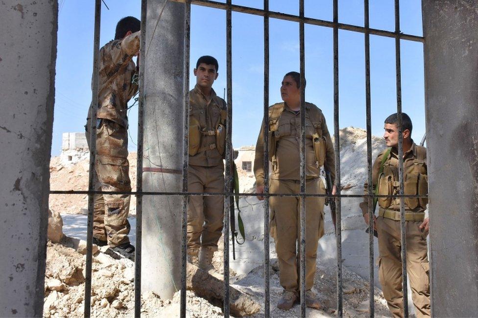 Photo taken in June 2017 shows Fighters from the Kurdish People's Protection Units (YPG) monitoring in the area of Afrin in Syria