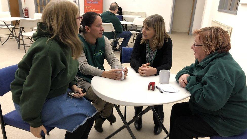 Helen Bull speaking with volunteers