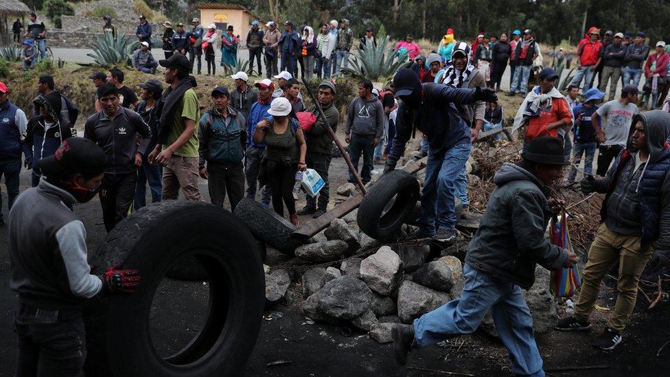 protesters block a road in Cangahua