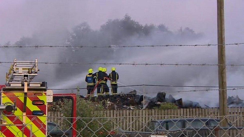 Firefighters work to bring the blaze under control