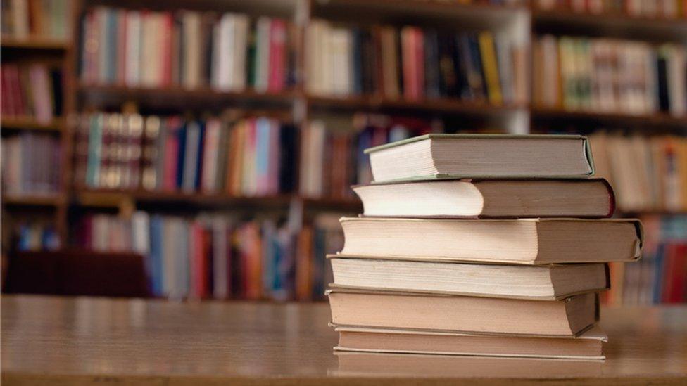 Stock image of books in a library