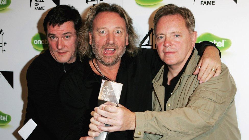 Left-right: Stephen Morris, Peter Hook and Bernard Sumner at UK Music Hall of Fame 2005