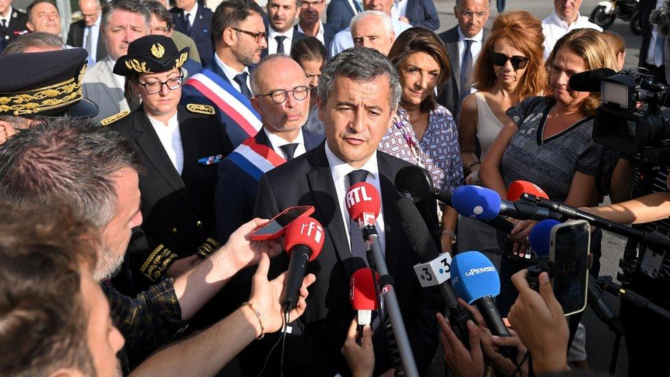 French interior minister Gerald Darmanin speaks to journalists at the headquarters of the elite Raid police unit