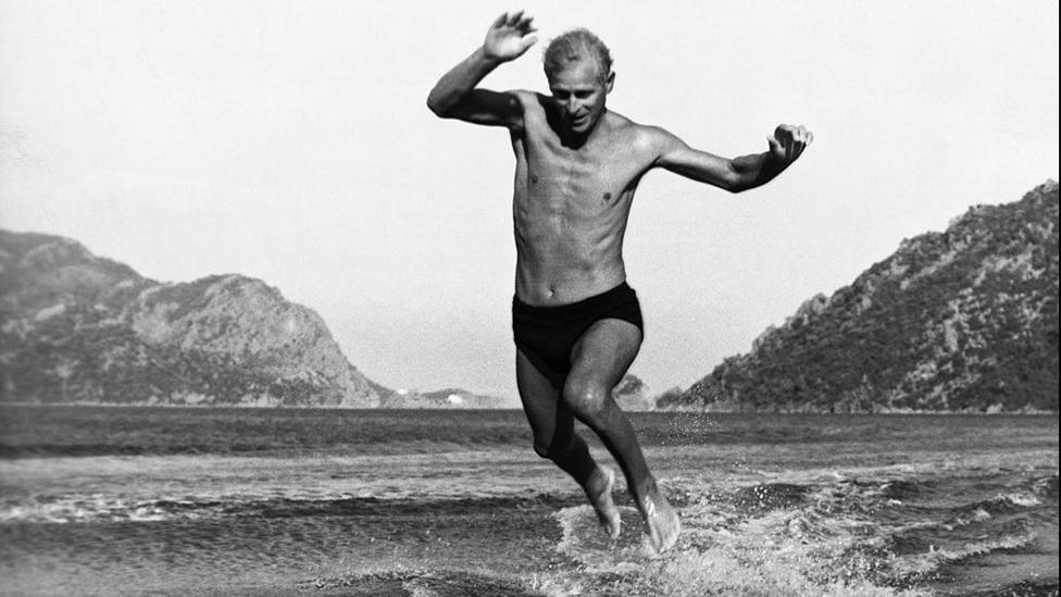 The Duke of Edinburgh jumping off the water skis