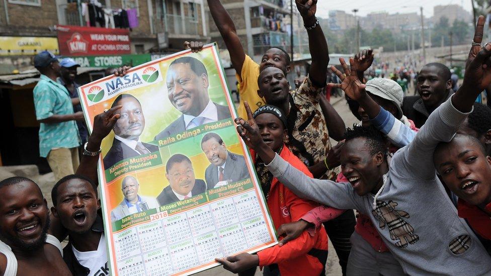 Image shows supporters of opposition candidate Raila Odinga celebrating in the street