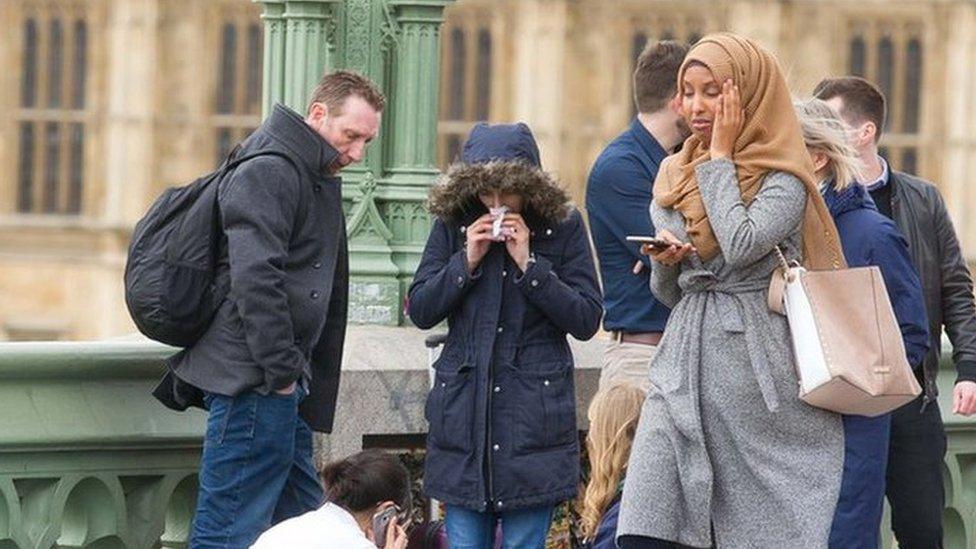 An account identified as a Russian bot shared this picture of a women wearing a hijab after the Westminster terror attack in March, claiming that as a Muslim, she was indifferent to the suffering of victims around her.