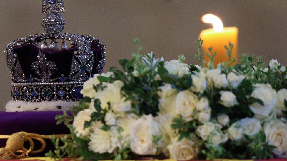 Crown, candle and flowers