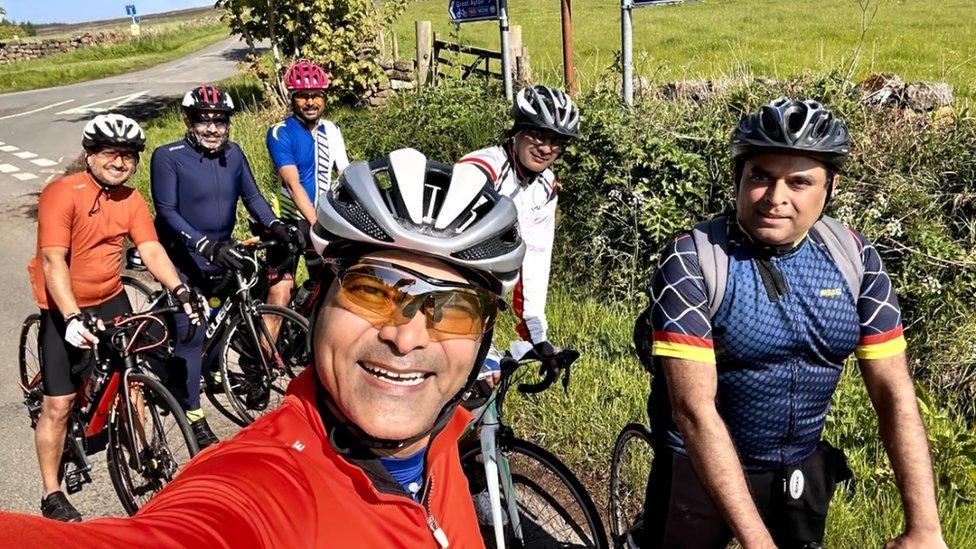 A group of cyclists on bikes