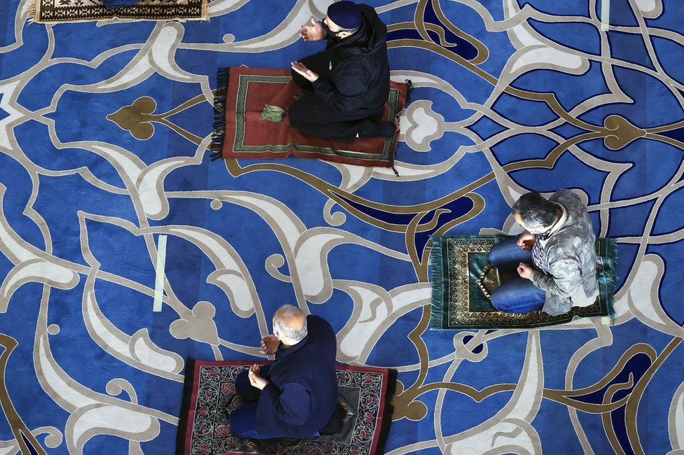 An aerial view of people performing Eid al-Fitr prayer with masks and social distancing at the Grand Camlica Mosque in Istanbul, Turkey