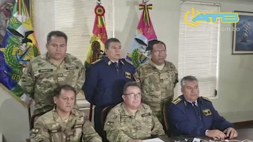 Grab taken from a handout video released by ATB showing the commander in chief of the Armed Forces, Williams Kaliman (C-bottom), speaking in a televised address from La Paz, on November 10, 2019.