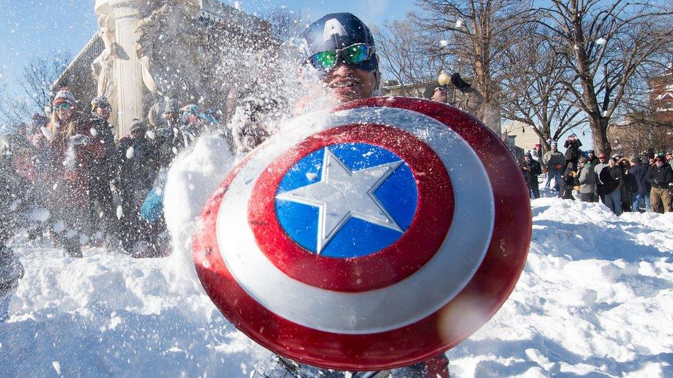 Captain America imitator in snowball fight