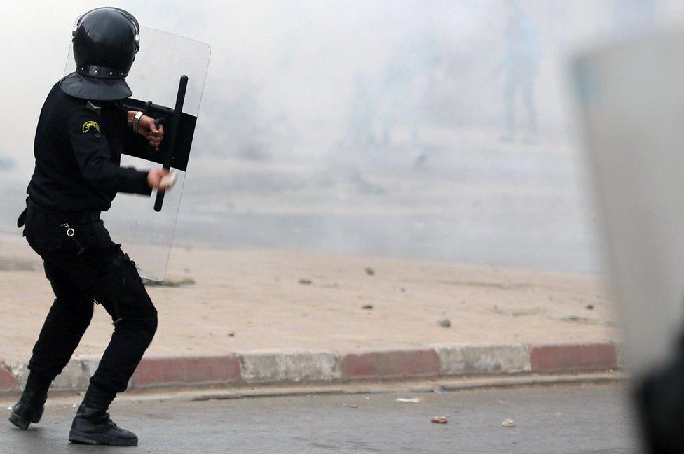 Riot police clash with protesters during demonstrations against rising prices and tax increases, in Tebourba, Tunisia, January 9, 2018