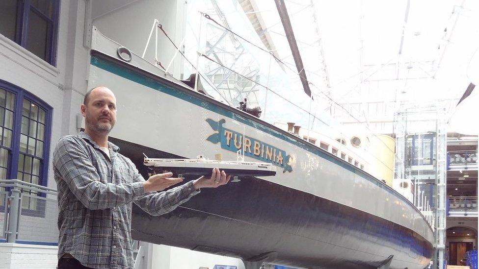 Lego artist Steve Mayes with his Turbinia model, standing next to the real Turbinia