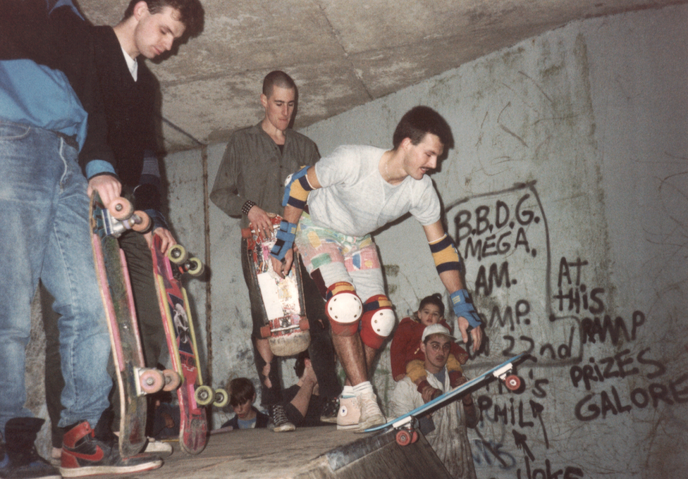 Skateboarders on a ramp