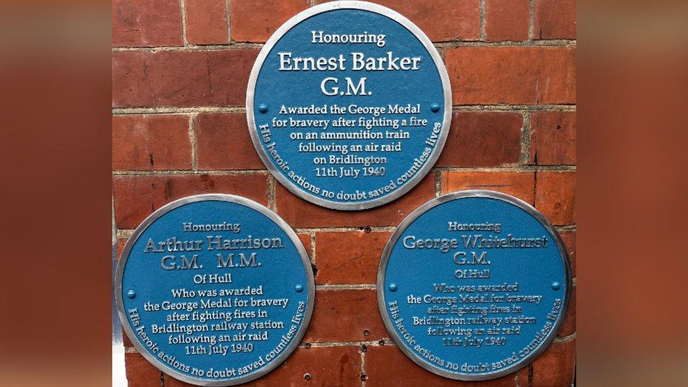 Three blue plaques