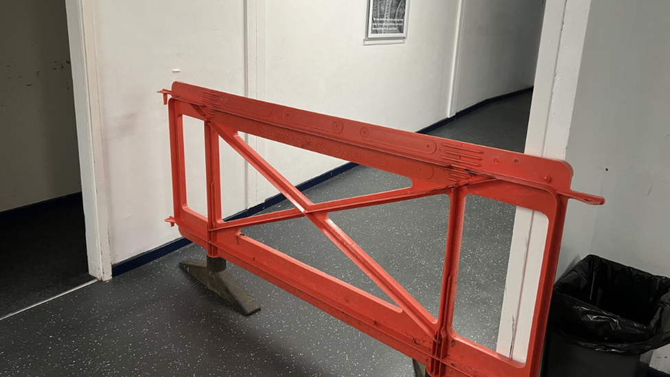 A barrier blocking off a corridor in Blue School