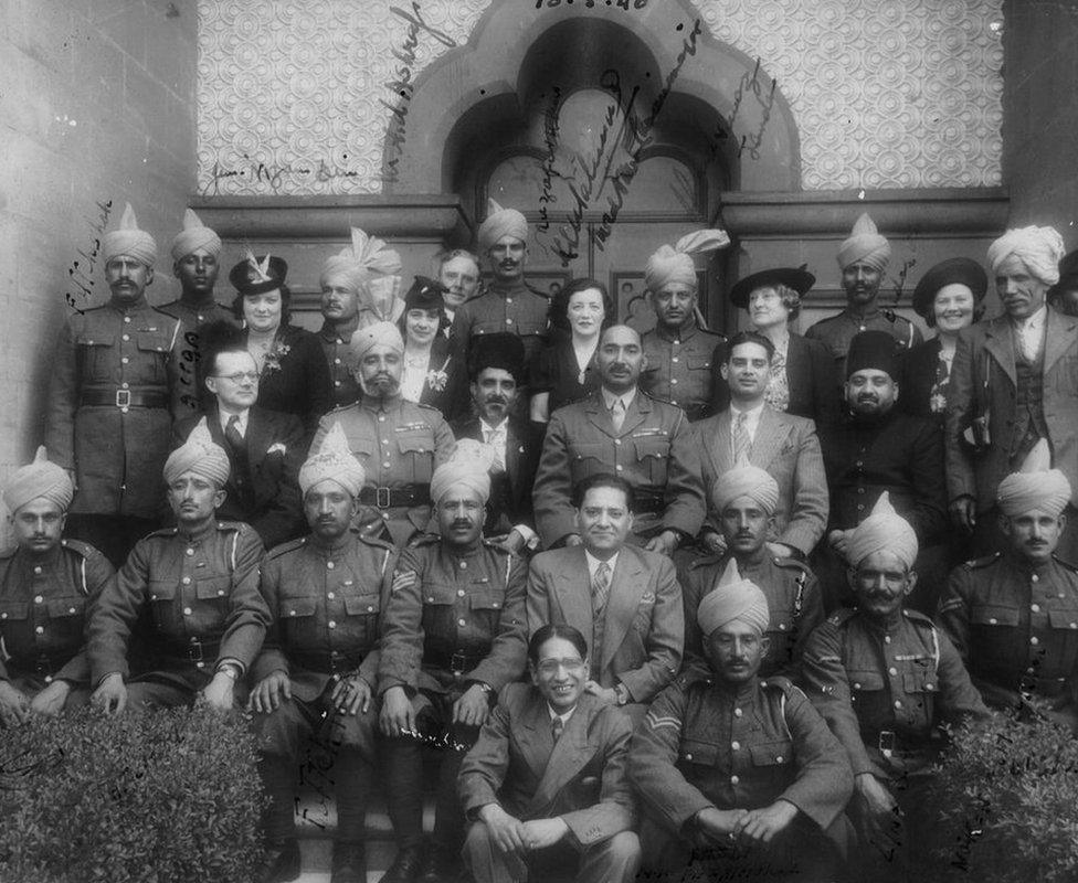 Leave party at Woking Mosque, 10 May 1940. Major Akbar is in the centre, in uniform, bareheaded. He has written in the names of many of the soldiers