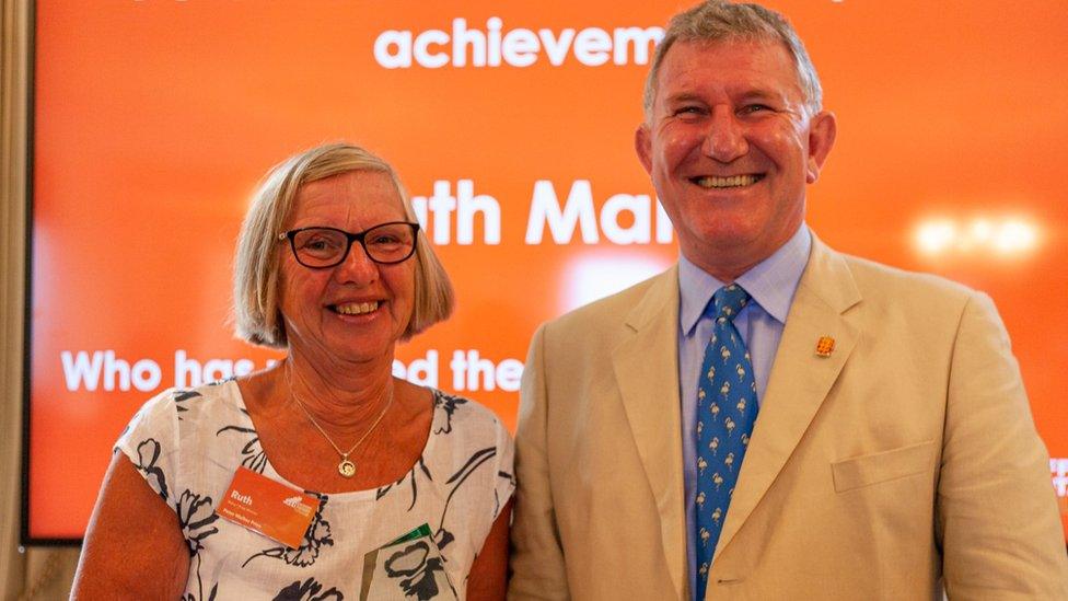 Ruth Mahy receiving an award from Guernsey's Lieutenant Governor