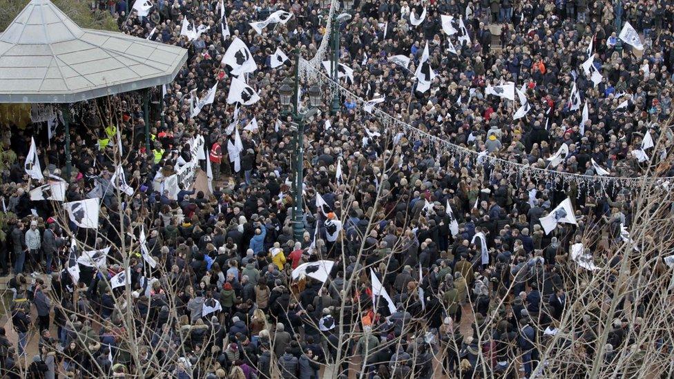 People gather in DeGaulle plaza in Ajaccio, on the French Mediterranean island of Corsica.