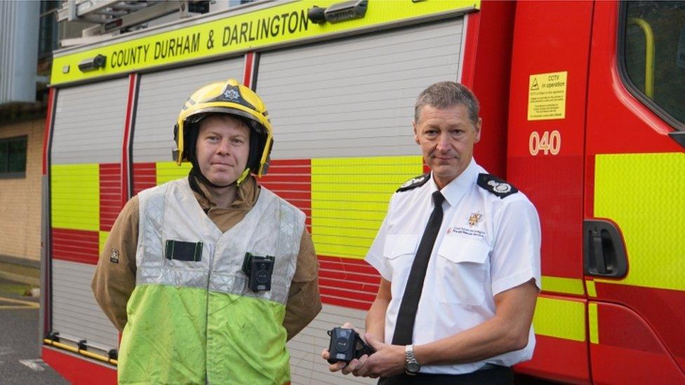 Firefighters holding bodycam