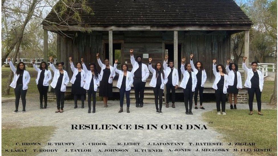 A photograph of 15 black med students in front of the former slave quarters at the Whitney Plantation went viral