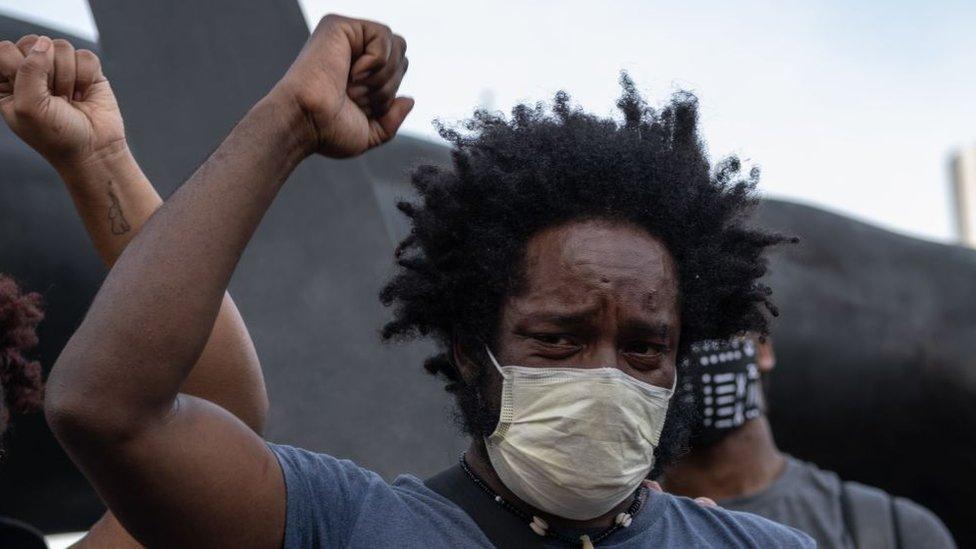 Tristen Taylor a protest organizer cries during a peaceful demonstration over the death of George Floyd, in Detroit, Michigan