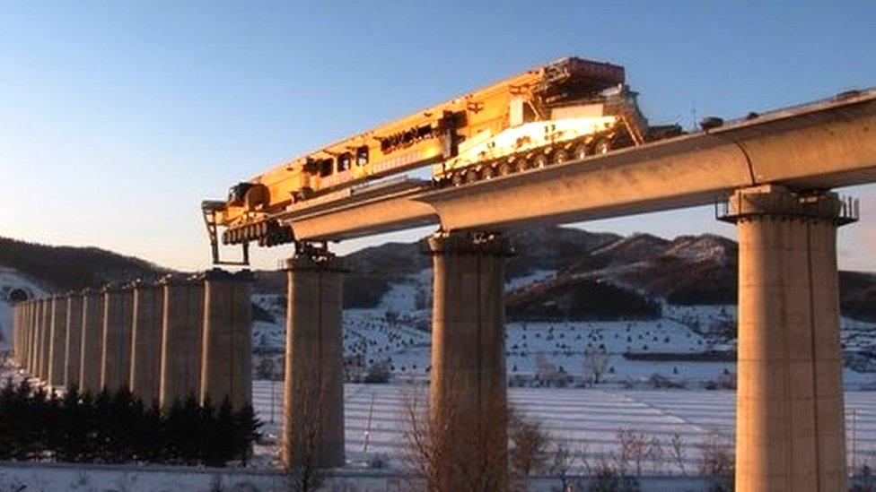 Machine going over bridge