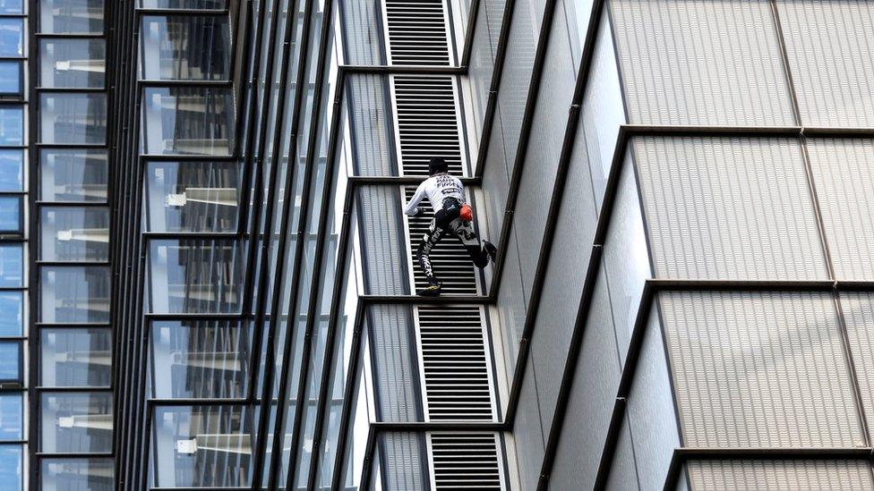 Alain Robert climbing the Heron Tower