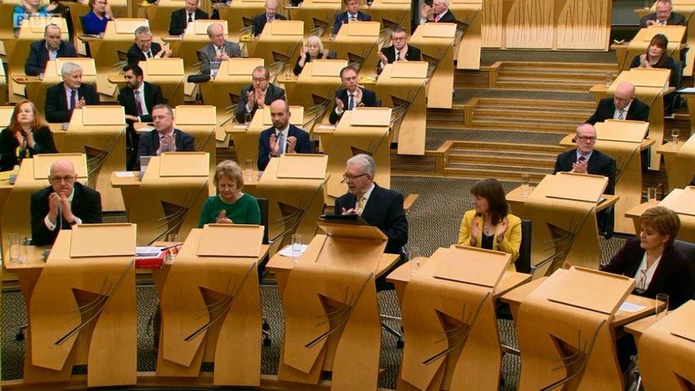 MSPs clapping